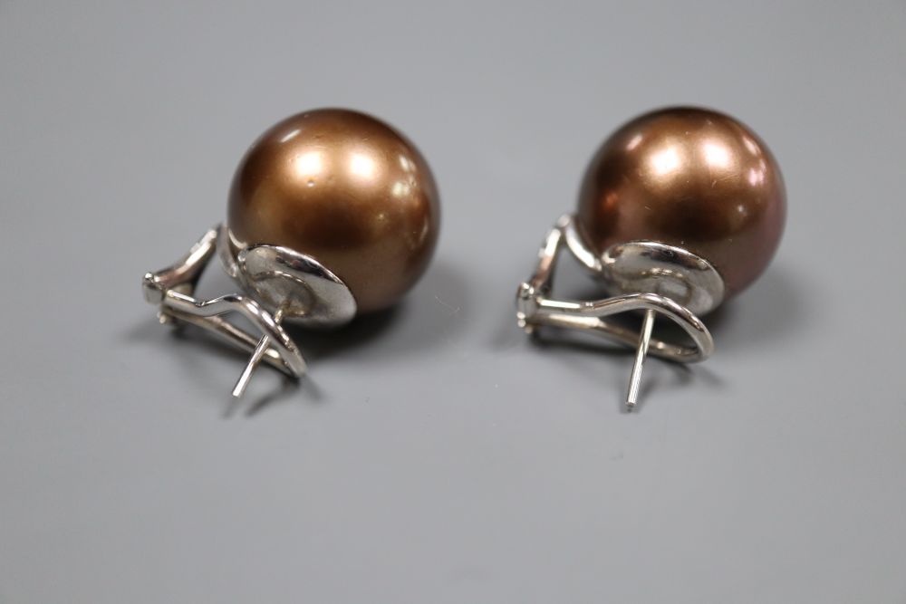 A large modern pair of white metal mounted brown freshwater pearl? earrings, diameter 16.6mm, gross 16.6 grams.